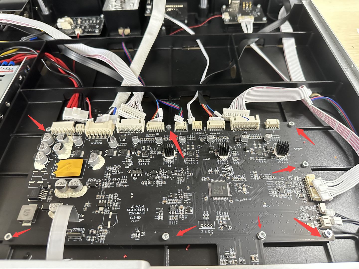 loosen_screws_securing_mainboard.png